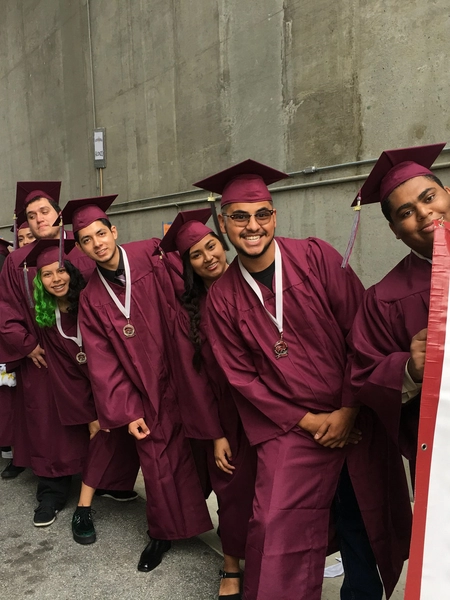 Avalon High School students in burgundy graduation caps and gowns